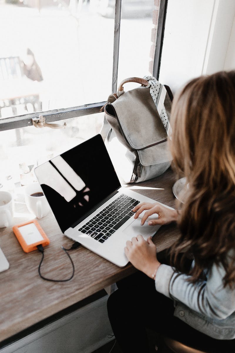 woman typing on laptop